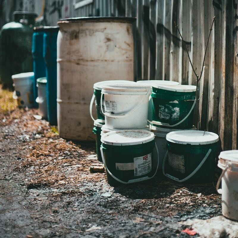 white and green plastic bucket